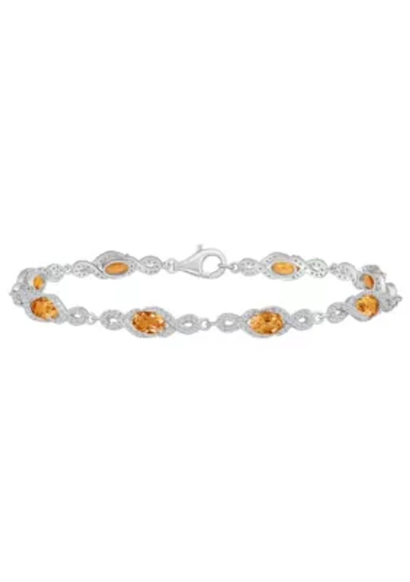 Sterling Silver 6x4mm Oval Citrine and White Topaz Accent Bracelet