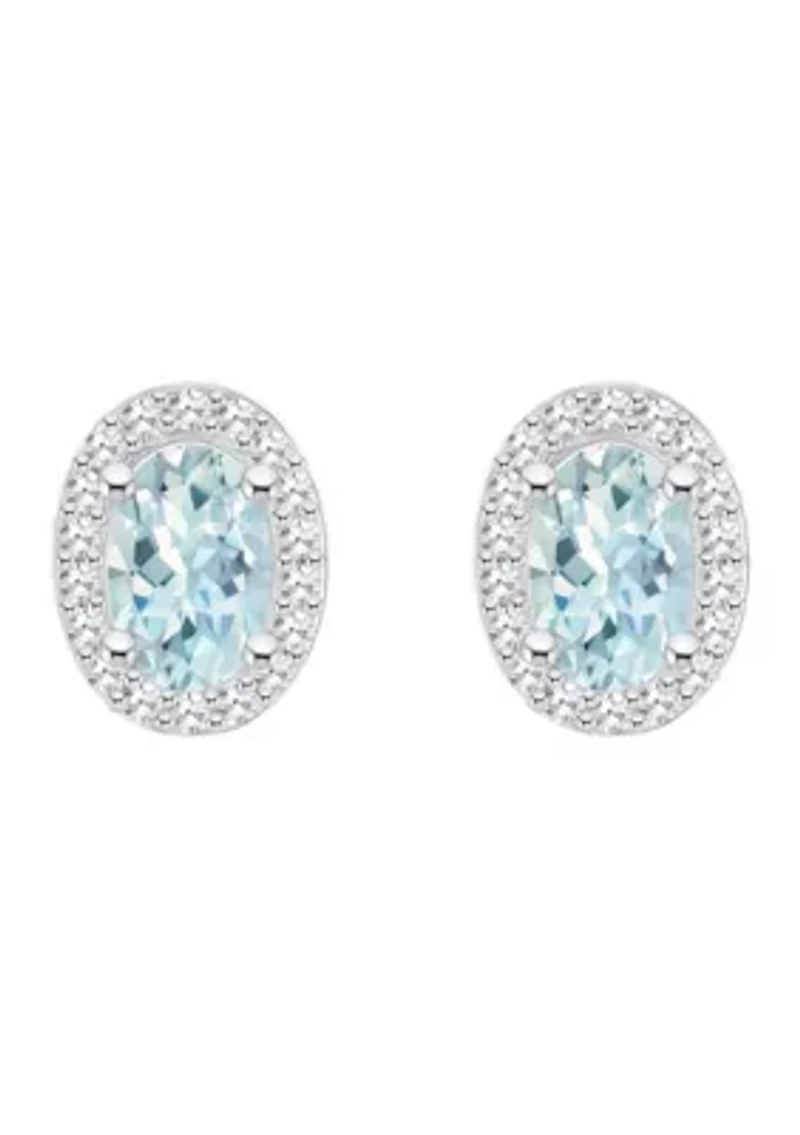 Sterling Silver 6x4mm Oval Aquamarine 1/5 CTTW Diamond Halo Stud Earrings