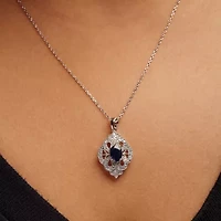 Silver 7x5 MM Oval Blue Sapphire and Diamond Art Deco Style Pendant Necklace