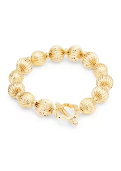 Gold Tone Textured Bead and Quatrefoil Toggle Stretch Bracelet