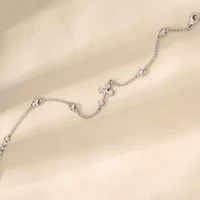 Lab Created Platinum Plated Sterling Silver Dainty Sideway Cubic Zirconia Station Bezel And Bottony Cross Bracelet
