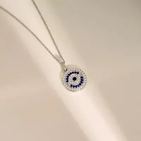 Lab Created Platinum Plated Sterling Silver Synthetic Sapphire and Clear Cubic Zirconia Round Evil Eye Pendant Necklace