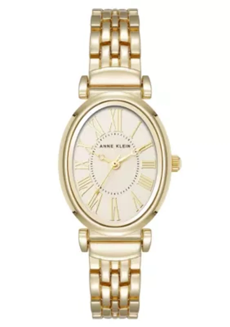 Anne Klein Women's Quartz Oval Roman Numeral Gold-Tone Metal Alloy and Champagne Dial Watch, 25mm