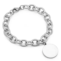 Ladies stainless steel curb link bracelet with round charm
