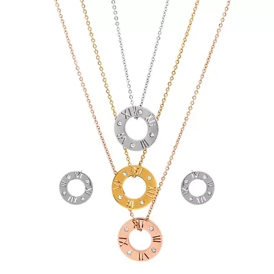 Ladies tricolor, stainless steel, 18k gold plated stainless steel, and 18k rose gold plated stainless steel simulated diamond and roman numeral earring and pendant set