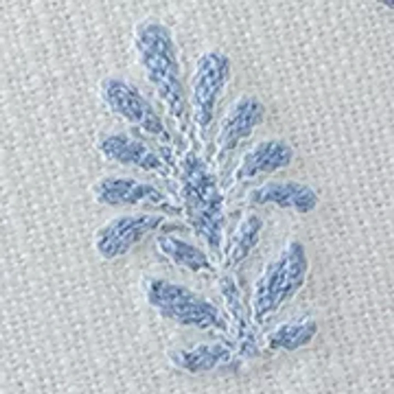Embroidered White and Blue Pillow