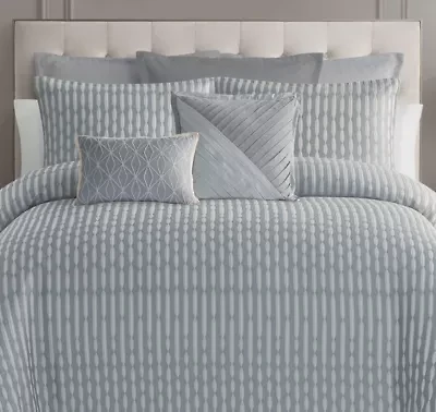 The Waterford Aretha Blue Euro Sham is the perfect complement to the Aretha Blue Comforter Set, offering an extra layer of luxury and sophistication to your bedding ensemble. Crafted from premium fabric in a serene blue hue, this euro sham features the same intricate pattern, adding texture and depth to your bed. Its elegant design makes it a stunning focal point when paired with the comforter, creating a harmonious and refined look. Whether stacked on your bed or used as a decorative pillow, the Aretha Blue Euro Sham adds a touch of timeless elegance to your home.