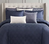 Enhance the elegance of your bedroom with the Waterford Chloe Navy Euro Sham. This beautifully crafted euro sham is designed to perfectly complement the Chloe Navy Comforter Set, offering a deep navy tone that adds a rich, luxurious feel to your bedding. Featuring the same intricate pattern in the comforter, the euro sham creates an elevated, cohesive look while adding depth and texture. An ideal addition for layering on your bed. The Chloe Navy Euro Sham is the perfect finishing touch, bringing a sophisticated and inviting atmosphere to your bedroom.