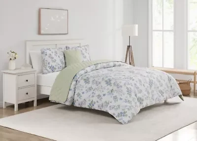 Transform your bedroom into a peaceful garden retreat with the Bird Garden Seafoam 5pc Comforter and Quilt Set. Featuring delicate watercolor blooms, fluttering butterflies, and soft bluebirds on silky microfiber