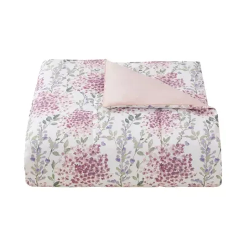 Bring serene charm to your bedroom with the Margot Mauve 5pc Comforter and Quilt Set. Delicate floral blooms in soft mauves and lavender hues are printed on silky microfiber, reversing to a soothing blush tone. Romantic, airy