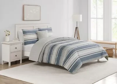 Refresh your space with the Easton Stripe 5pc Comforter and Quilt Set. Featuring classic stripes in blue, gray, and ivory, this set includes a cozy comforter, quilt, 2 shams, and a decorative pillow—perfect for effortless