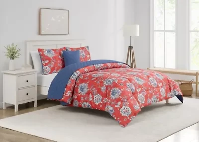 Brighten your bedroom with the Zinnia Blue 5pc Comforter and Quilt Set. Featuring a vibrant red floral print with a reversible blue quilt, this set includes a comforter, quilt, 2 shams, and a decorative pillow—perfect for bold style and cozy