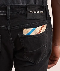 Nick Metal Logo Patch Slim Jeans
