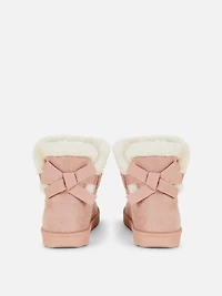 Snug Back Bow Boots