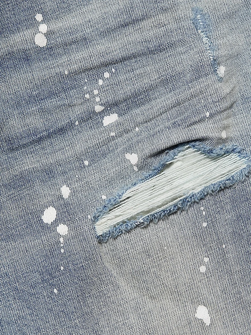 P001 Paint Splatter Distressed Skinny Jeans