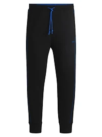 Stretch-Cotton Tracksuit Bottoms with Embossed Artwork