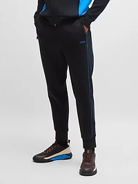 Stretch-Cotton Tracksuit Bottoms with Embossed Artwork