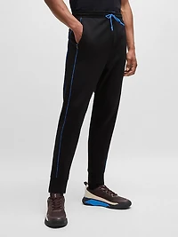 Stretch-Cotton Tracksuit Bottoms with Embossed Artwork