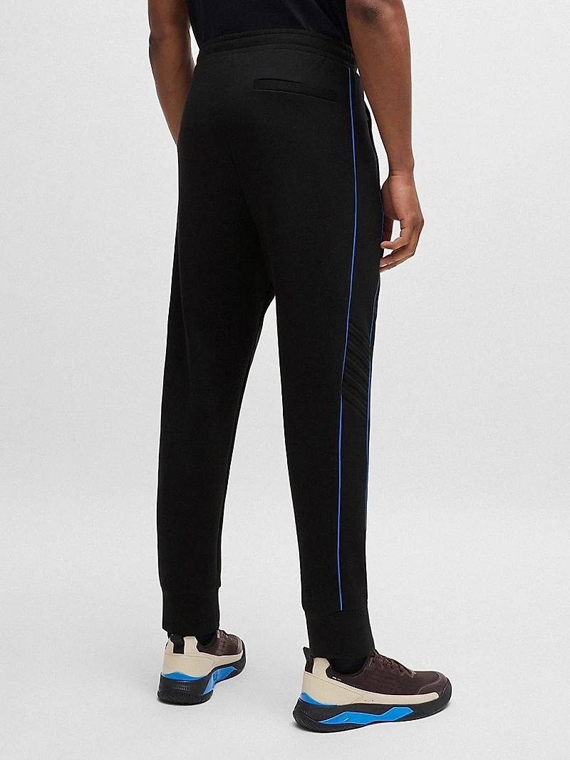 Stretch-Cotton Tracksuit Bottoms with Embossed Artwork
