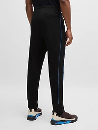Stretch-Cotton Tracksuit Bottoms with Embossed Artwork