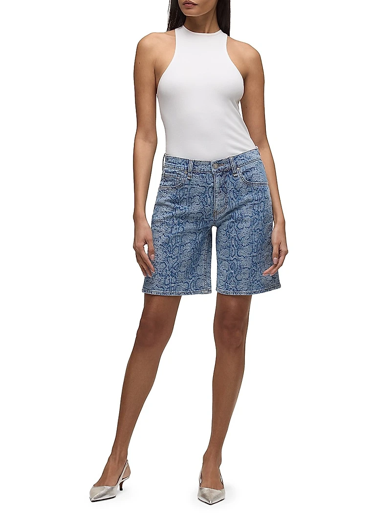 London Snake-Print Denim Low-Rise Long Shorts