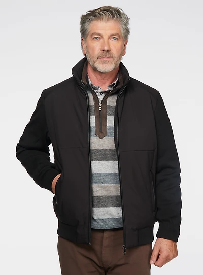 Manteau noir avec manches en tricot