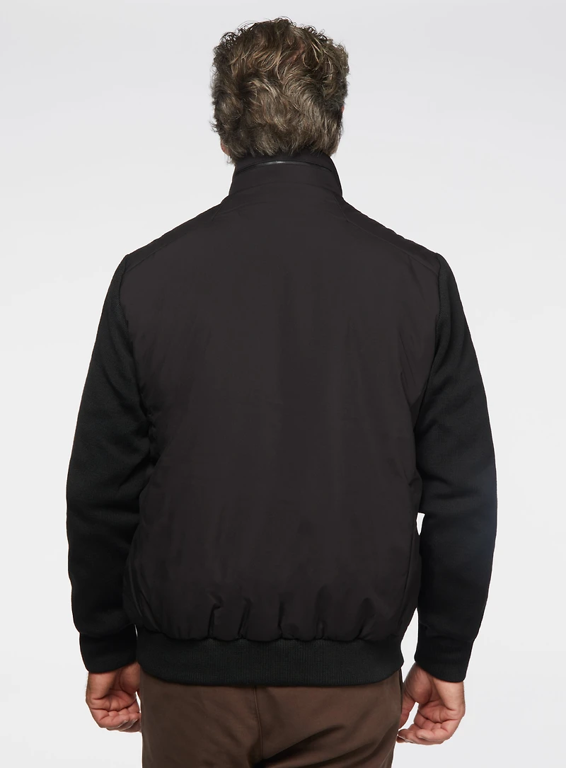 Manteau noir avec manches en tricot