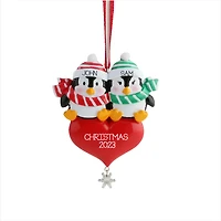 Penguin Sitting on the Heart Ornament