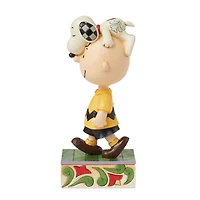 Snoopy on Charlie Brown's Head