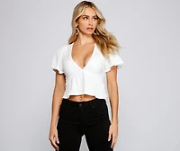 Pleated and Poised Peplum Blouse
