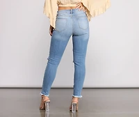 Mid Rise Frayed Cropped Skinny Jeans