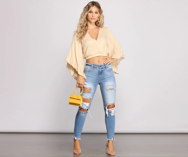 Mid Rise Frayed Cropped Skinny Jeans