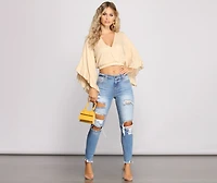 Mid Rise Frayed Cropped Skinny Jeans