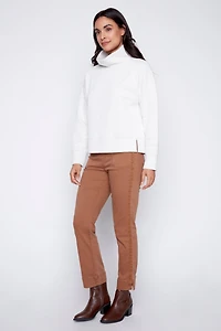 Le haut en tricot froncé
