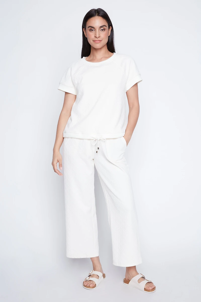 Le haut à ourlet cordon en maille losange