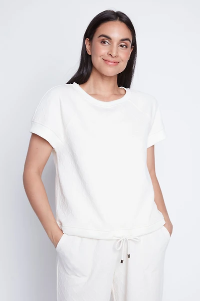 Le haut à ourlet cordon en maille losange