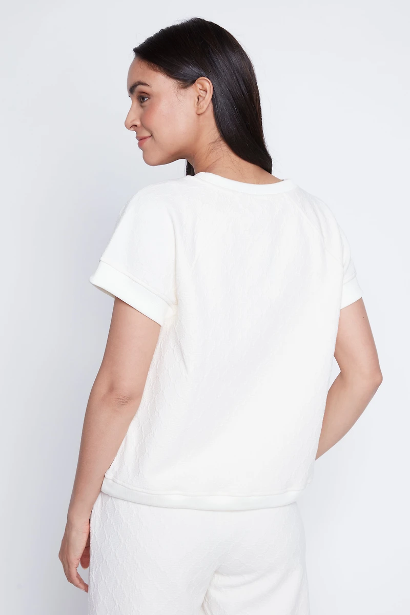 Le haut à ourlet cordon en maille losange