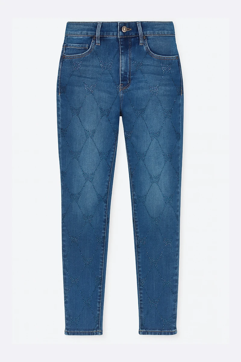 Le jean à jambe étroite motif papillons en strass