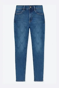 Le jean à jambe étroite motif papillons en strass
