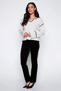 Le pull brodé au dos