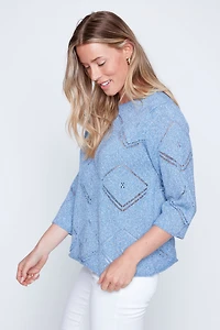 Le pull au crochet à motif losanges