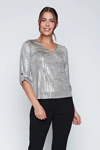 Le haut en tricot à boucle perlée