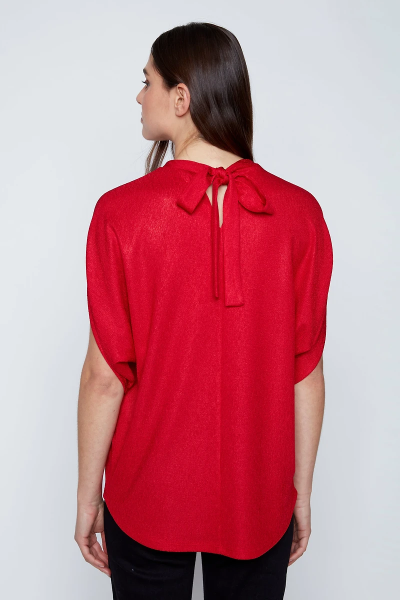 Le haut lurex à nœuds