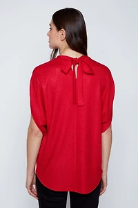 Le haut lurex à nœuds