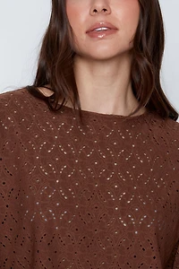 Dolman sleeve eyelet top
