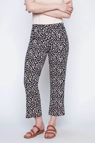 Le pantalon à motif pois bicolore noir et beige