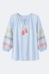 La blouse rayé avec détails brodés