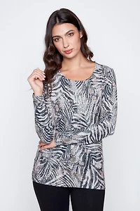 Le haut en tricot à imprimé zèbre et fleurs