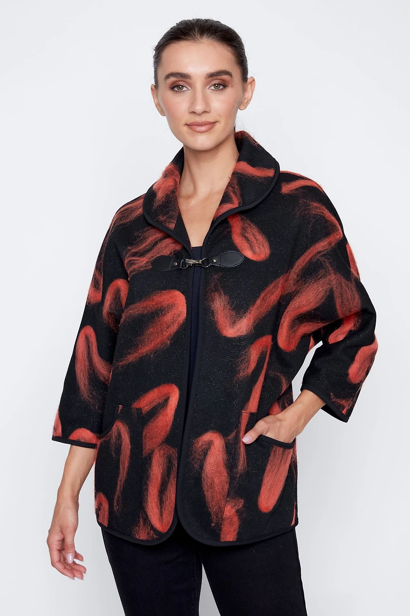 La veste en maille jacquard floconnée