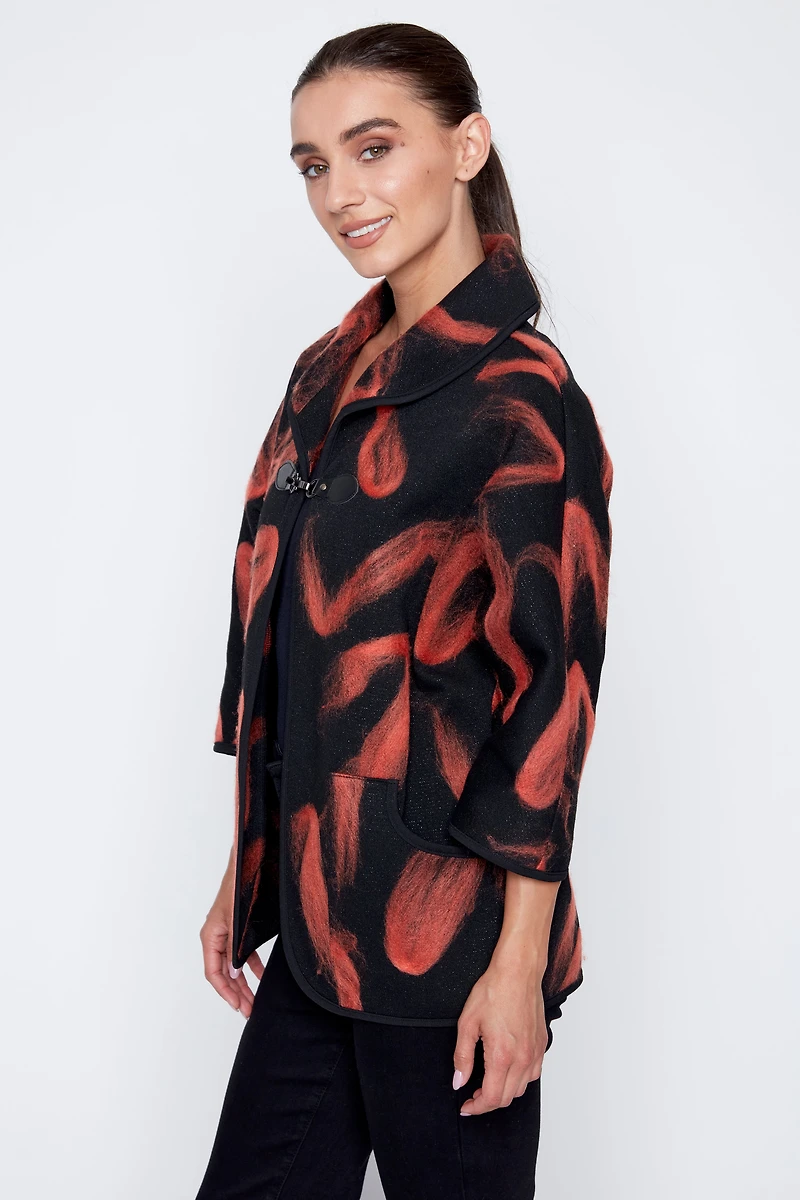 La veste en maille jacquard floconnée